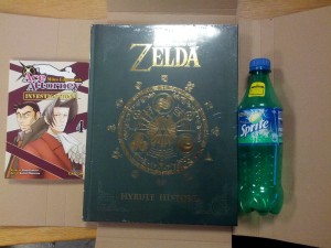 The Legend of Zelda: Hyrule Historia and Ace Attorney Investigations: Miles Edgeworth vol. 4. Bottle for size comparison.